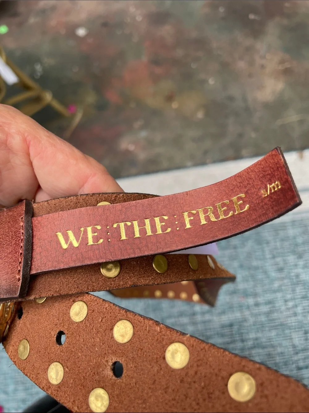 The free gold grommet studded belt with gold buckle